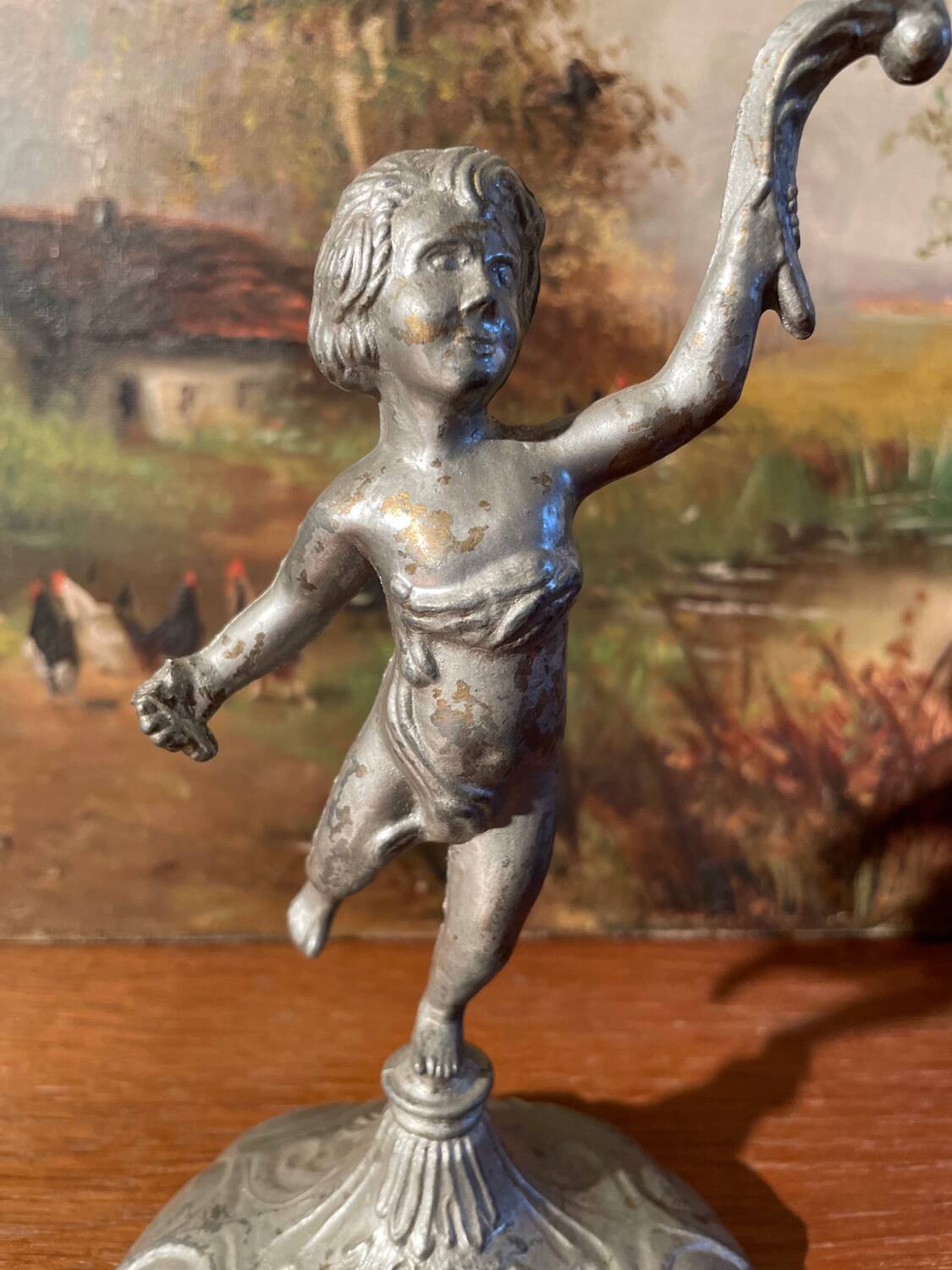 Old cherub candle holder