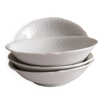 12 porcelain bowls with slip decoration and floral frieze