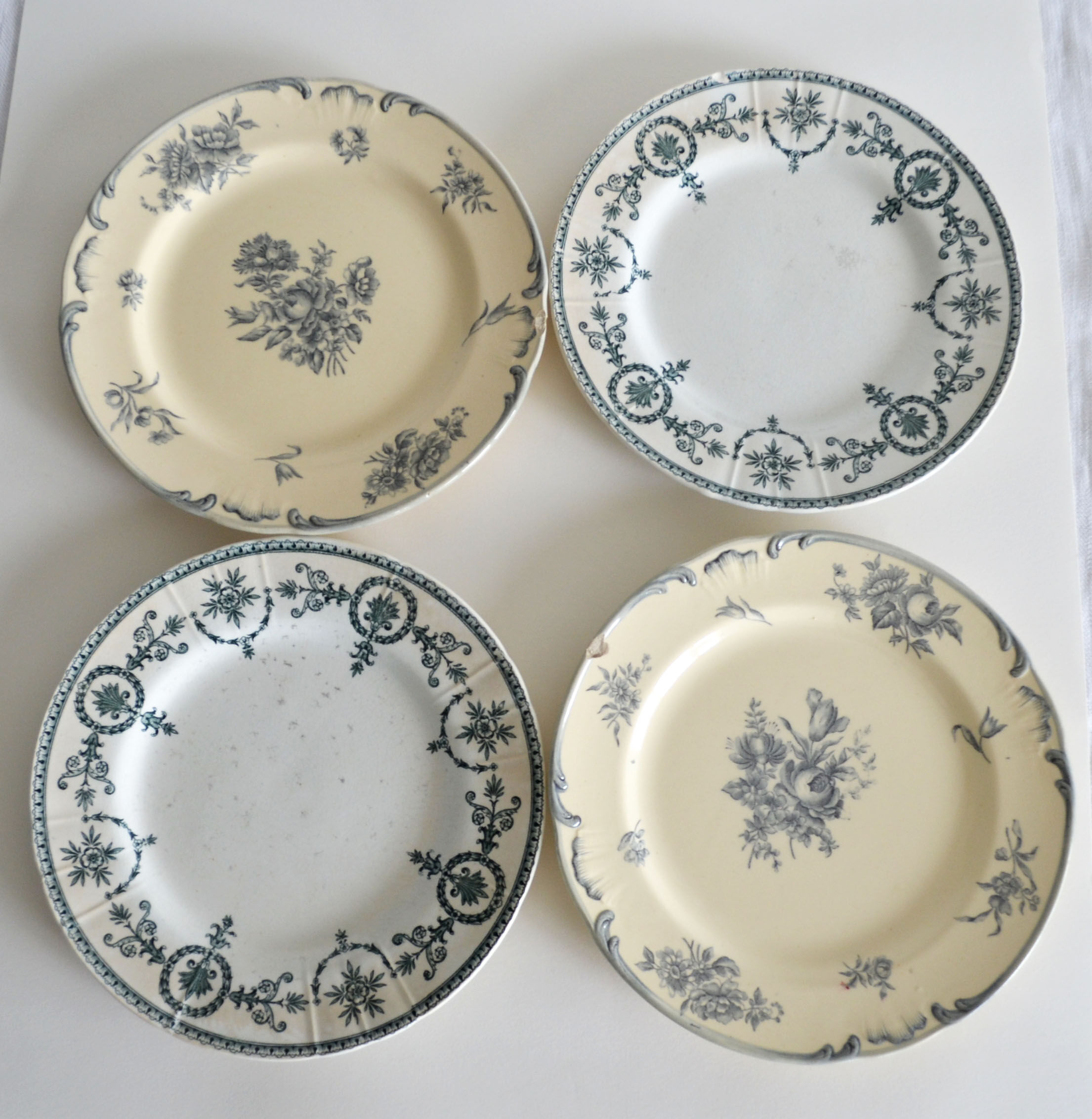 4 mismatched iron earth dessert plates