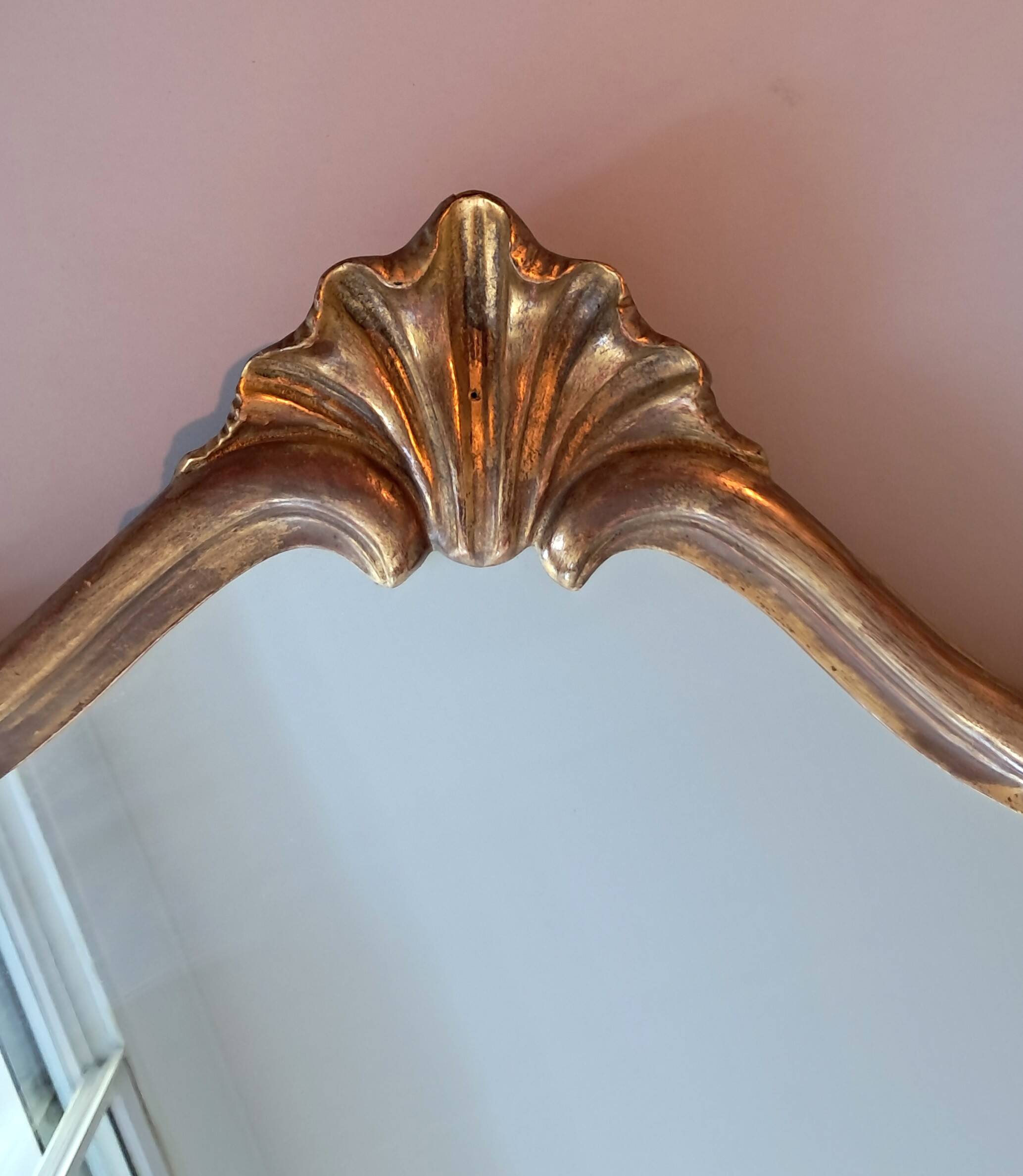 1950s rococo mirror in gilded stucco.