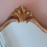 1950s rococo mirror in gilded stucco.