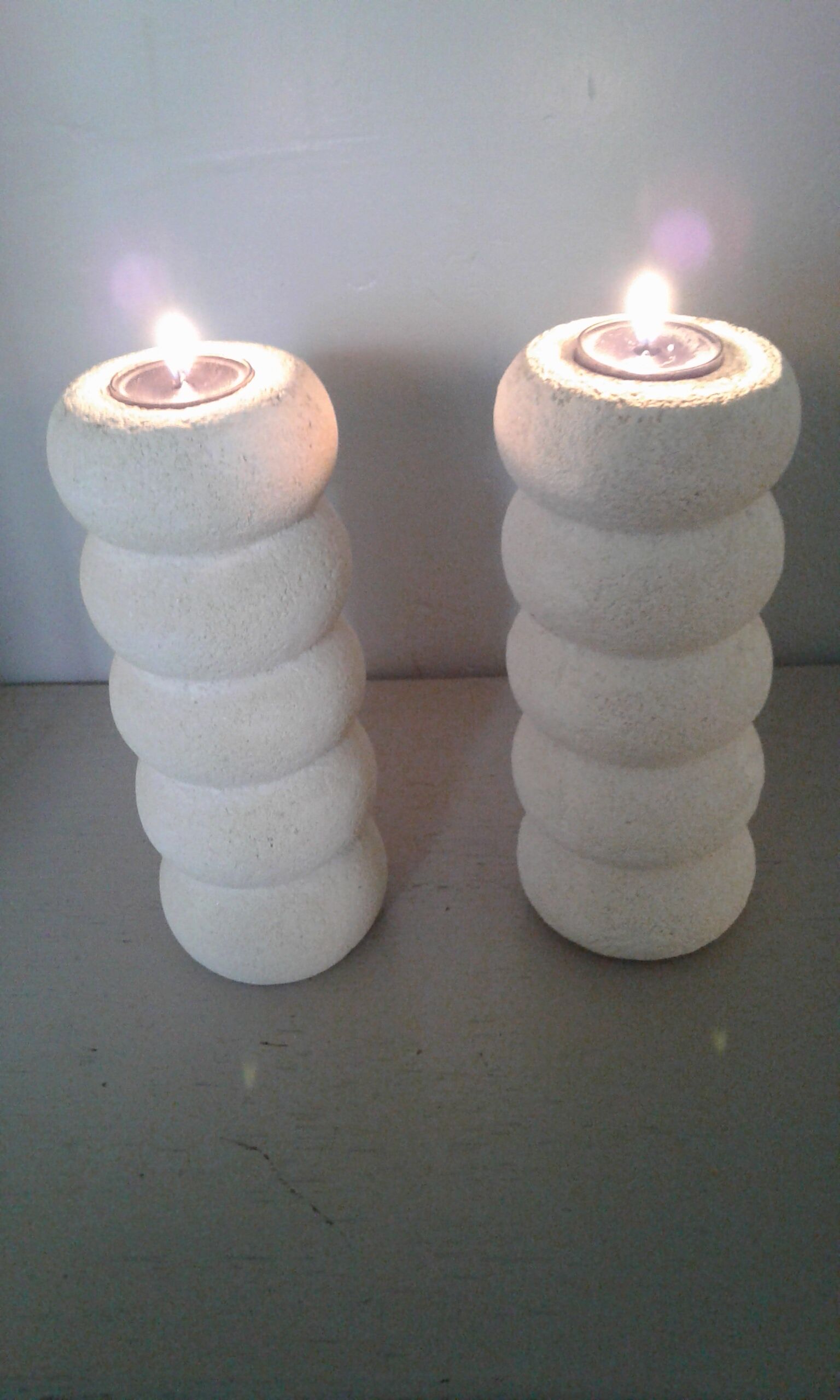 Pair of stone candlesticks
