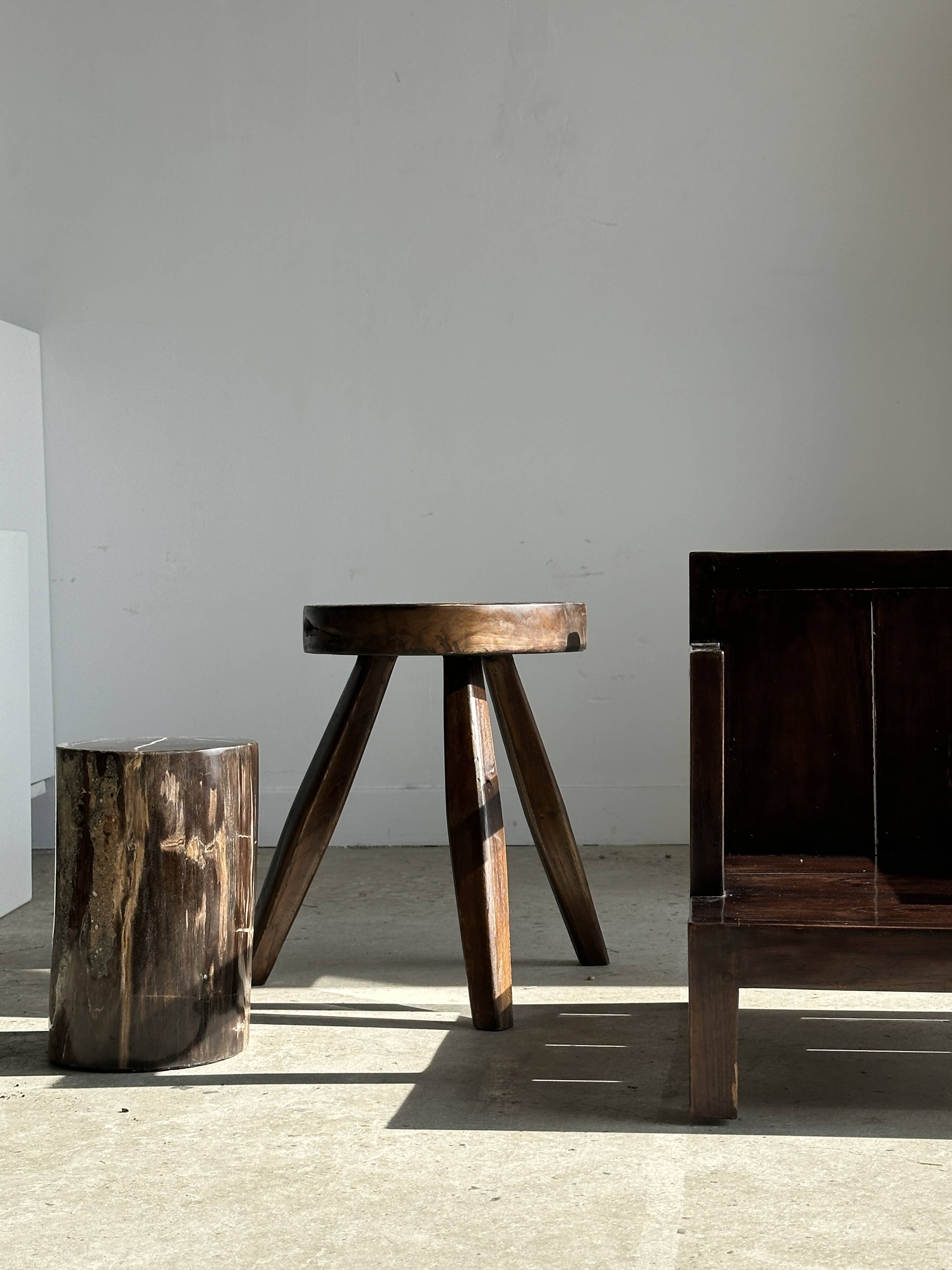 Small low armchair in varnished brown wood