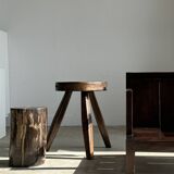 Small low armchair in varnished brown wood