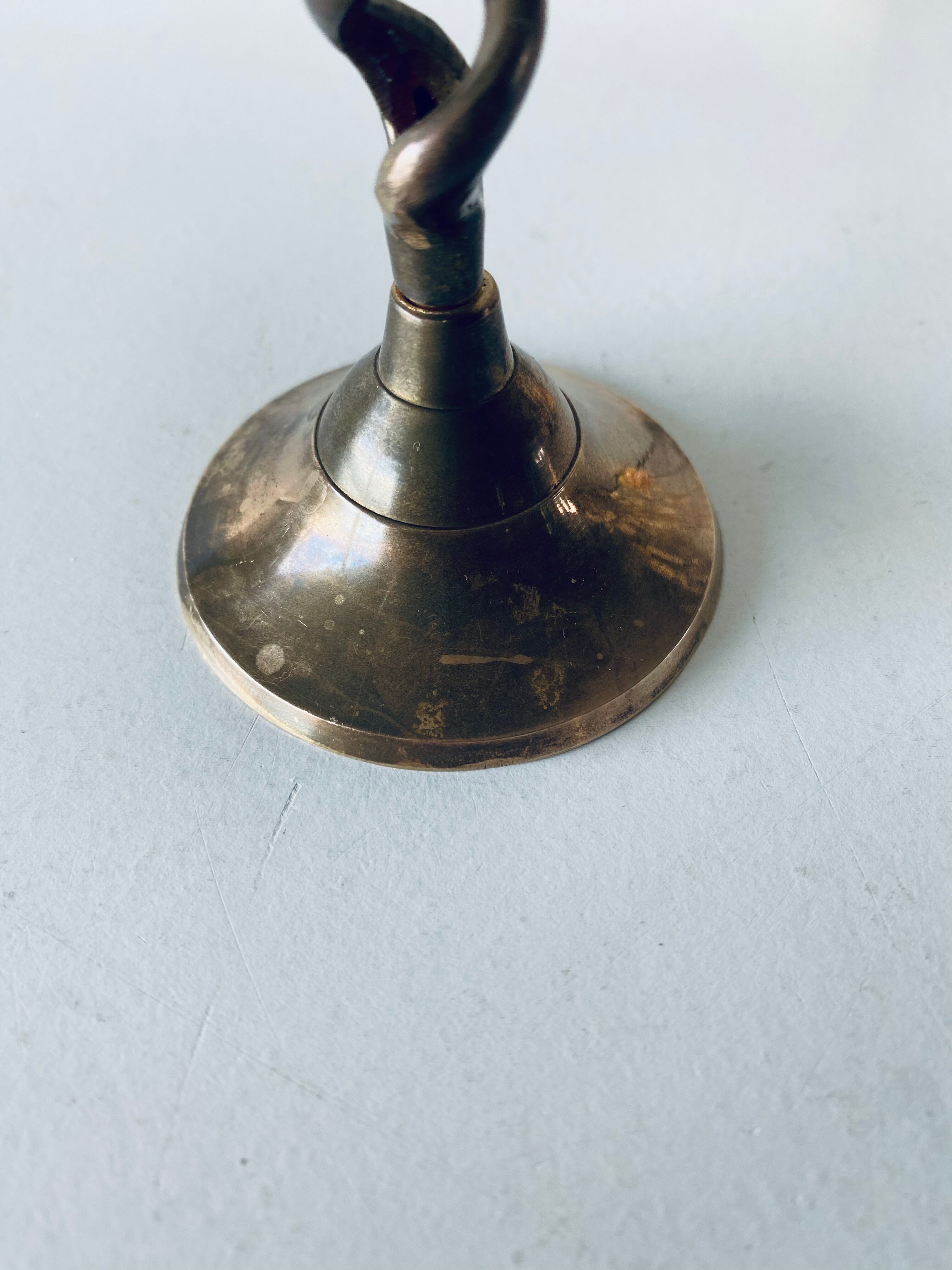 Twisted brass candle holder