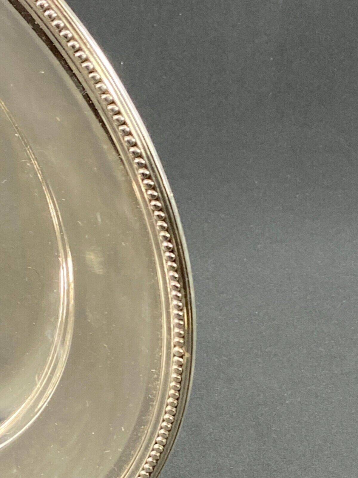 Circular silver metal dish signed Christofle pearl model