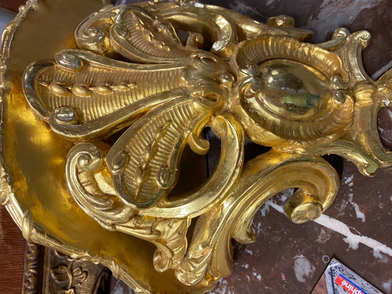 Golden wall applique with gold leaf