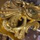 Golden wall applique with gold leaf