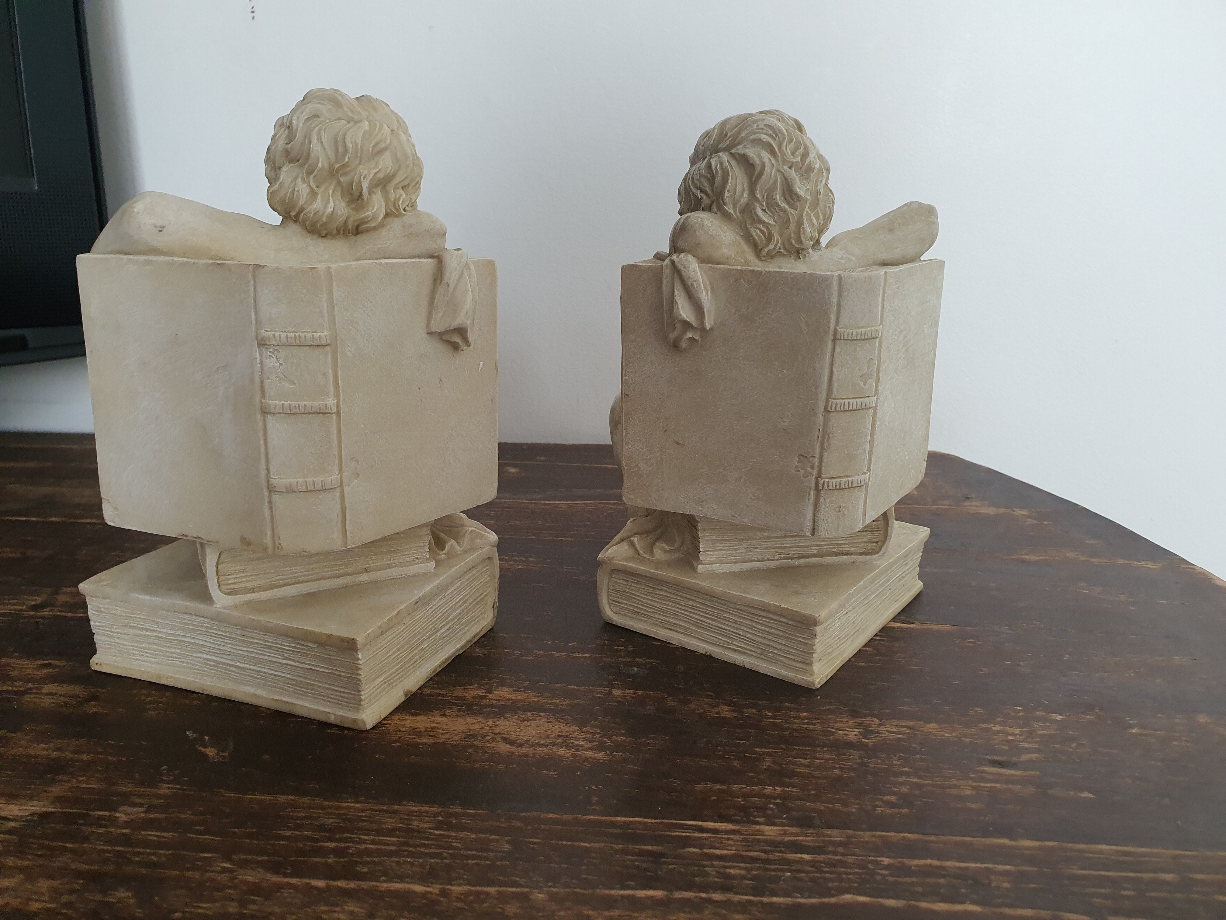 Angel bookends sitting in stone art deco 1950