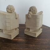 Angel bookends sitting in stone art deco 1950