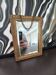 Small vintage mirror in gilded wood, bevelled glass with chain.