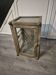 Brown weathered wooden display cabinet with 2 glass shelves.