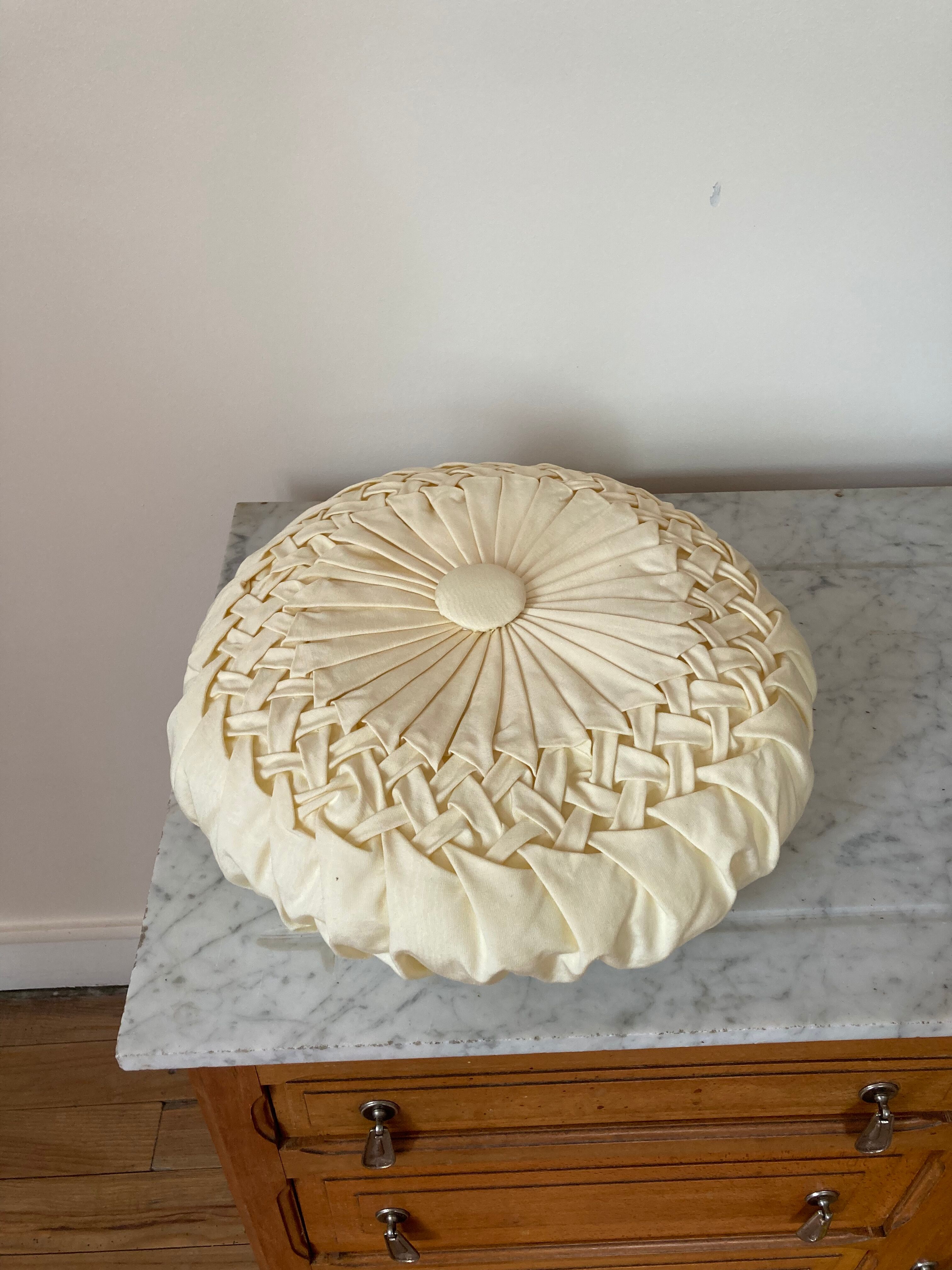 Cushion in beige fabric