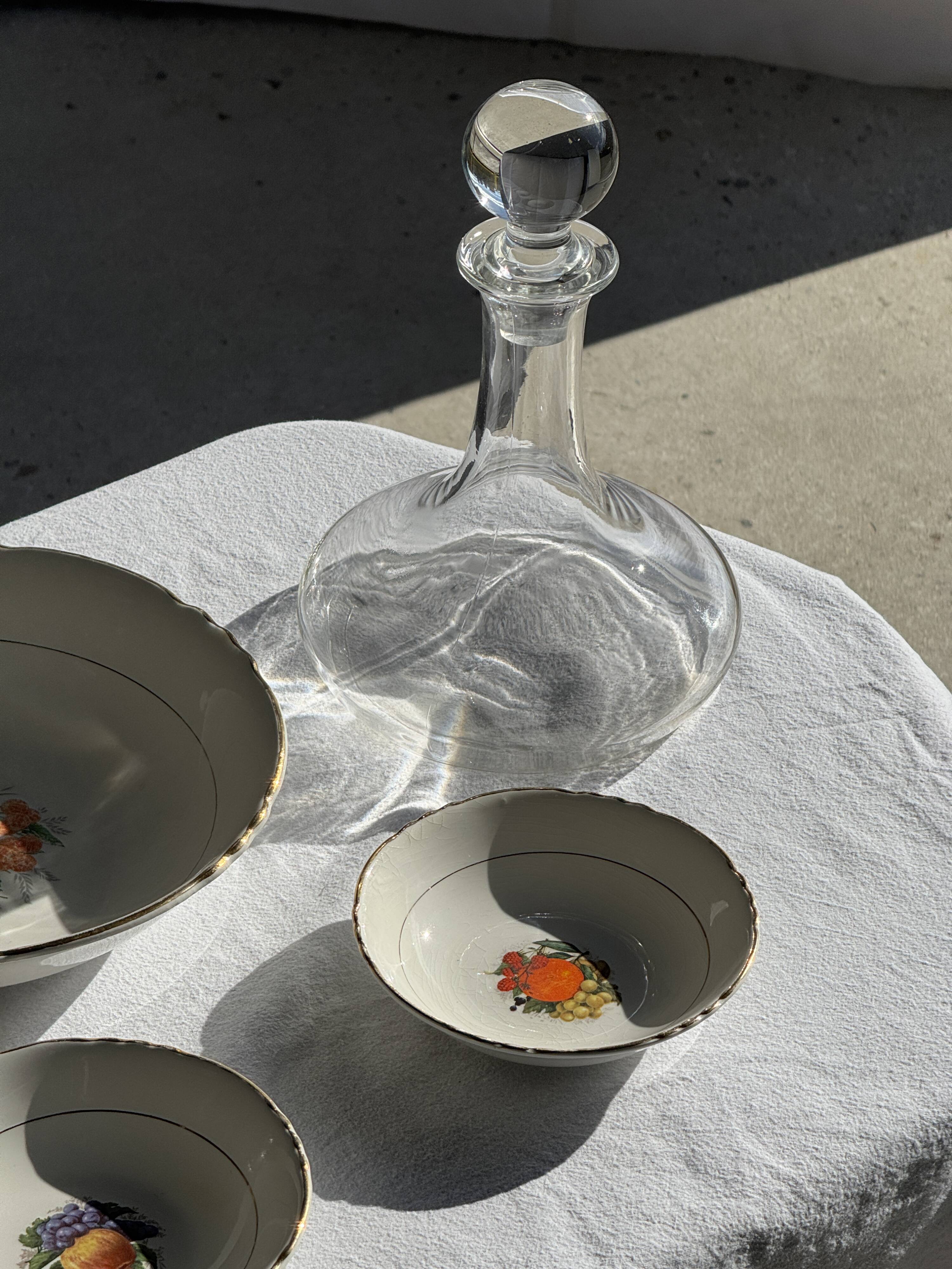 Vintage fruit salad service consisting of a bowl and 7 small dishes.