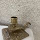 Cellar rat candlestick in gilded brass chised flower pattern, foliage and old face