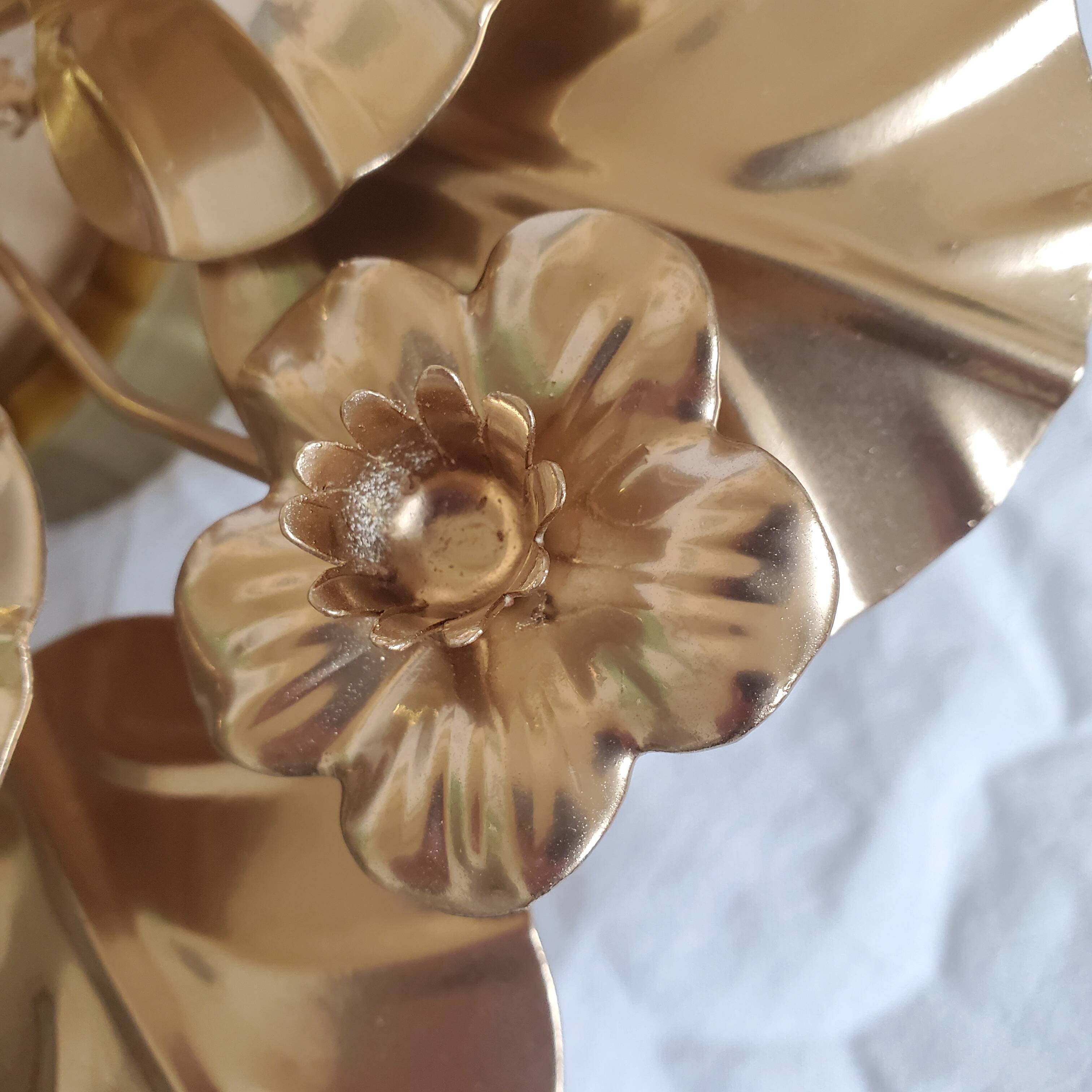 Golden metal flower sconces