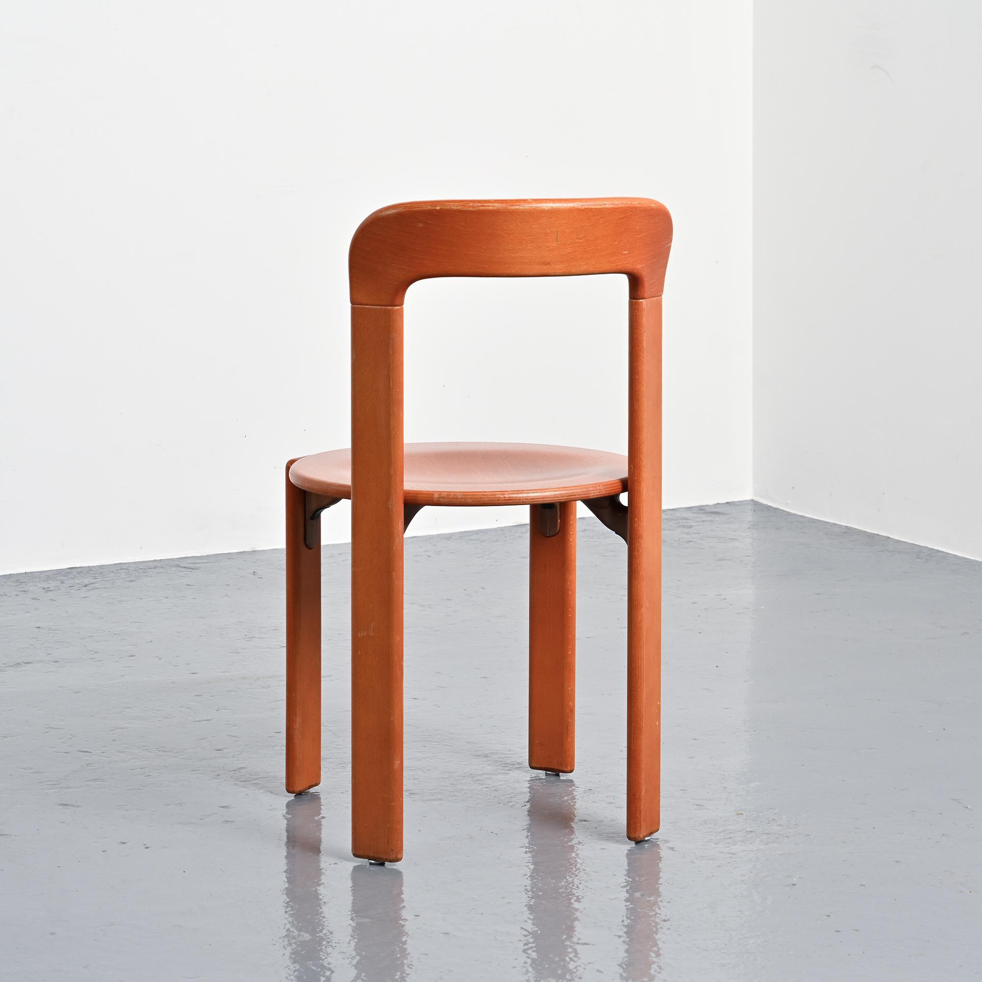 Rey chairs in stained red beech by Bruno Rey