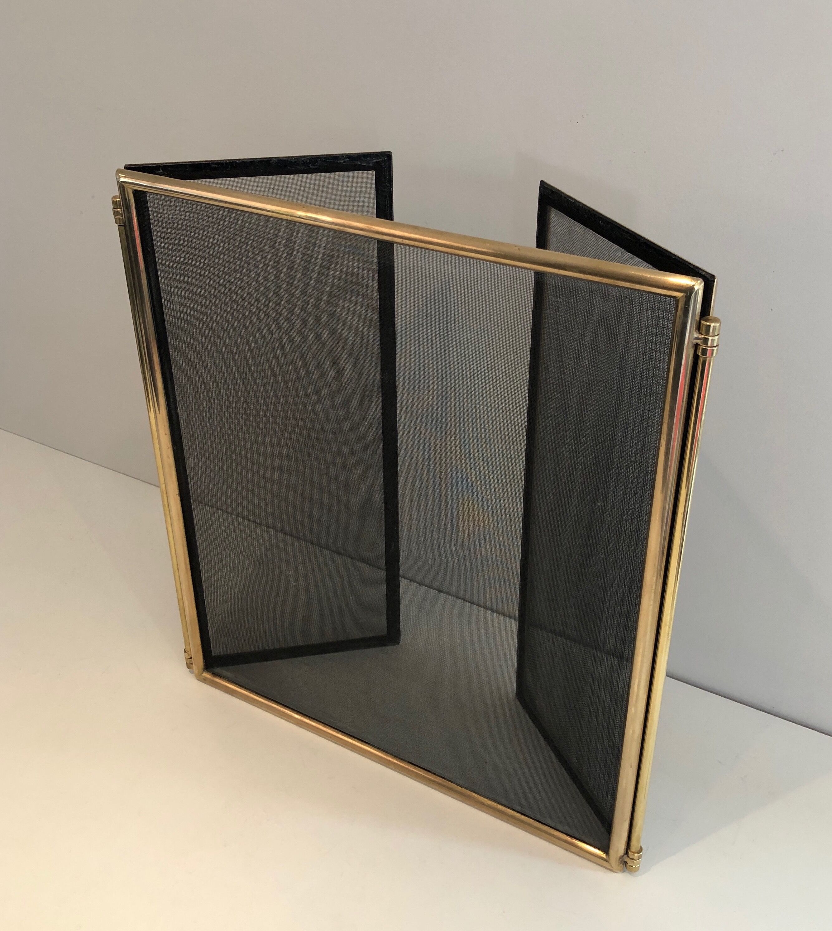 Brass and wire mesh firewall. french work. around 1970