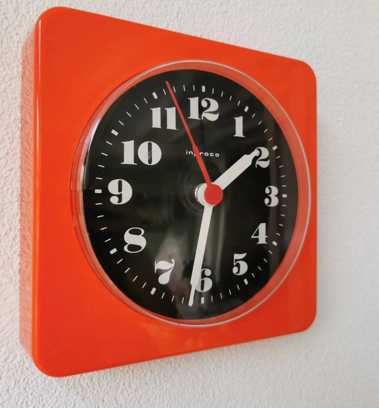 Vintage orange wall clock made of Inproco plastic, 1970