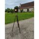 Spotlight on wooden and chrome tripod.