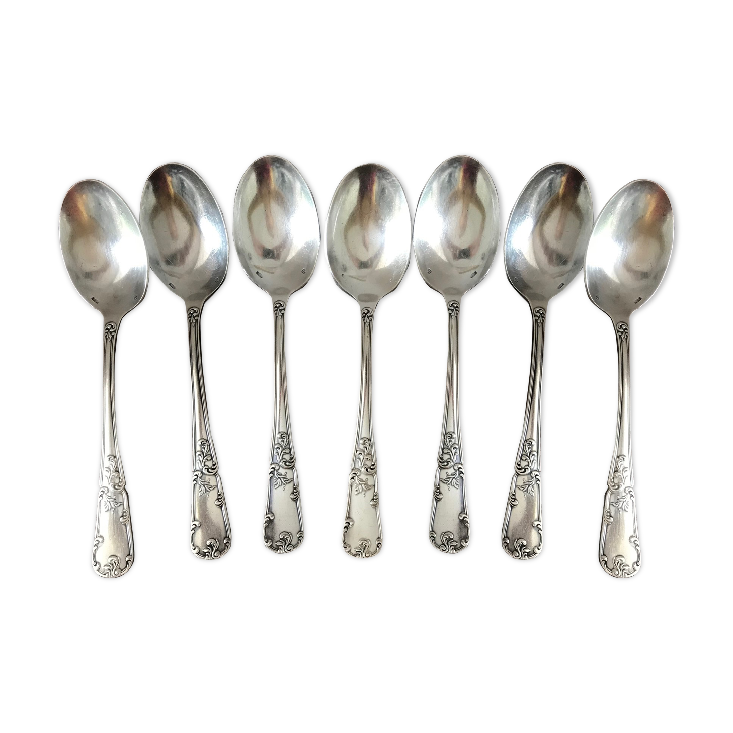 Set of 7 tablespoons in flowered silver metal with punch