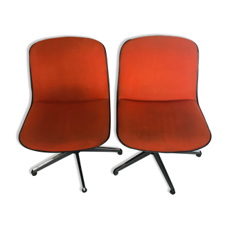 Pair of orange swivel office chairs from the 70s