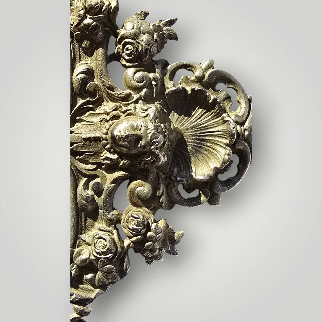 Gilded bronze wall mirror, beveled glass