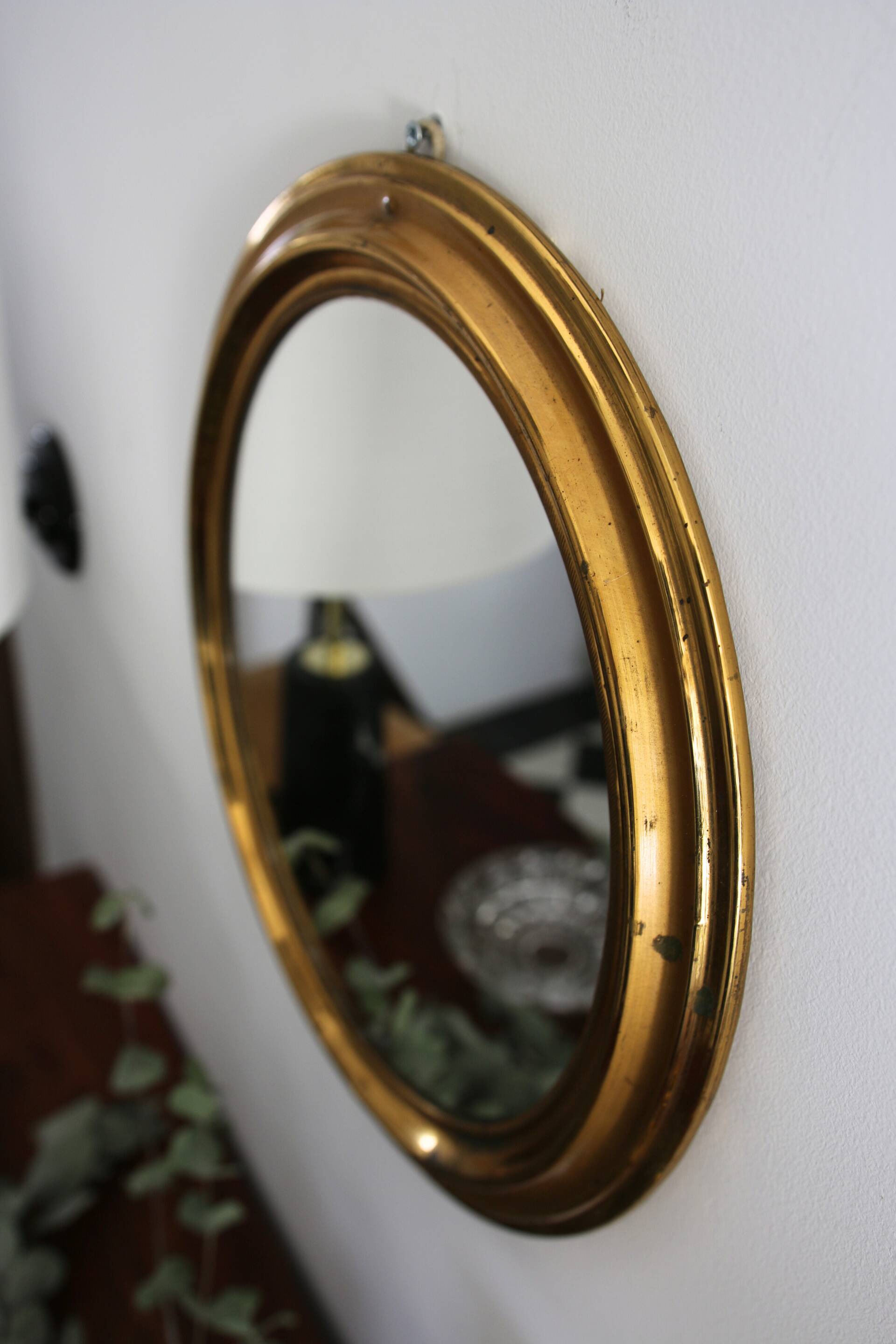 Oval brass mirror
