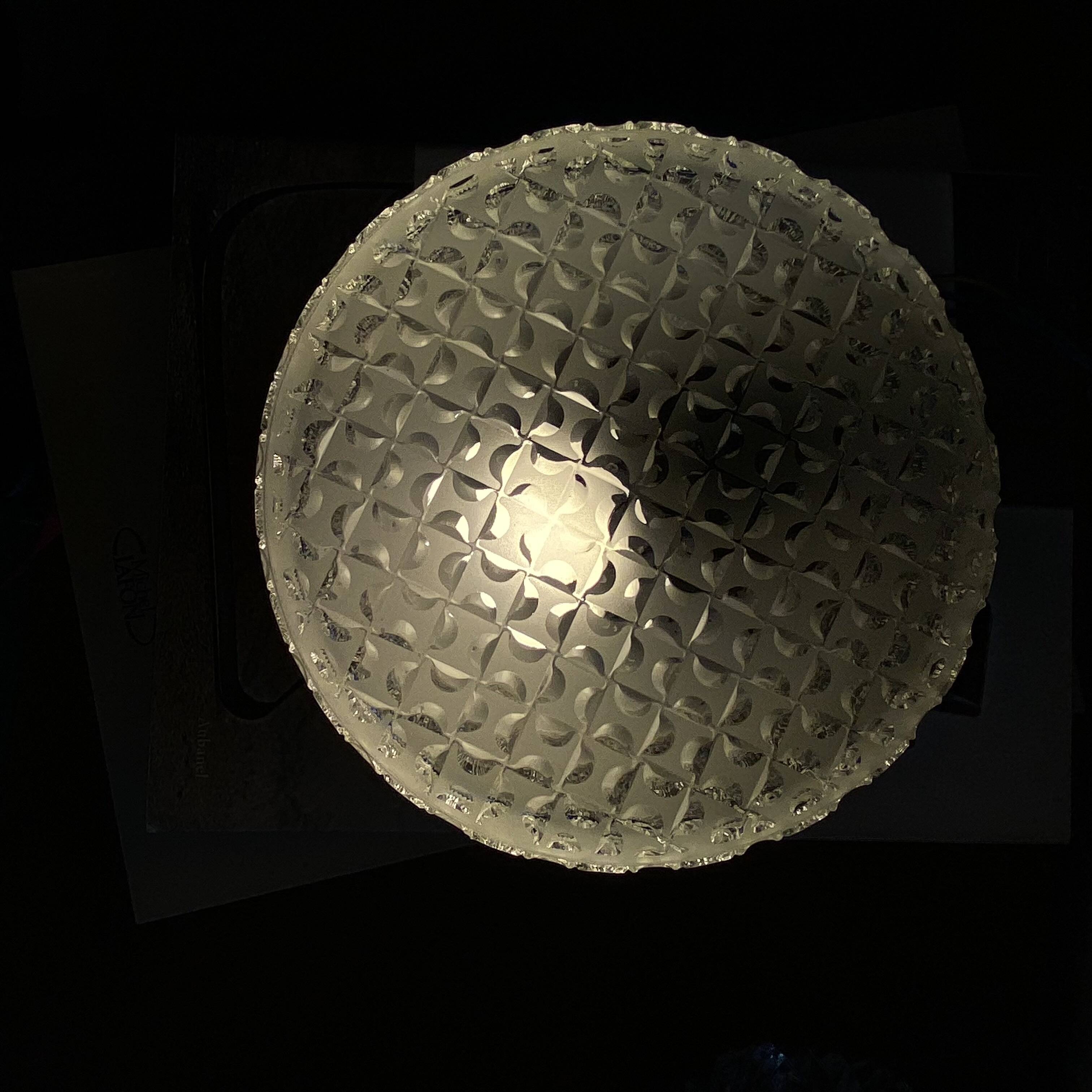 Round wall light or ceiling light with transparent glass from the 1970s.