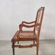 Fauteuil canné en bois naturel