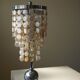 Art Deco table lamp with a mother-of-pearl top and Funkis-style frame.