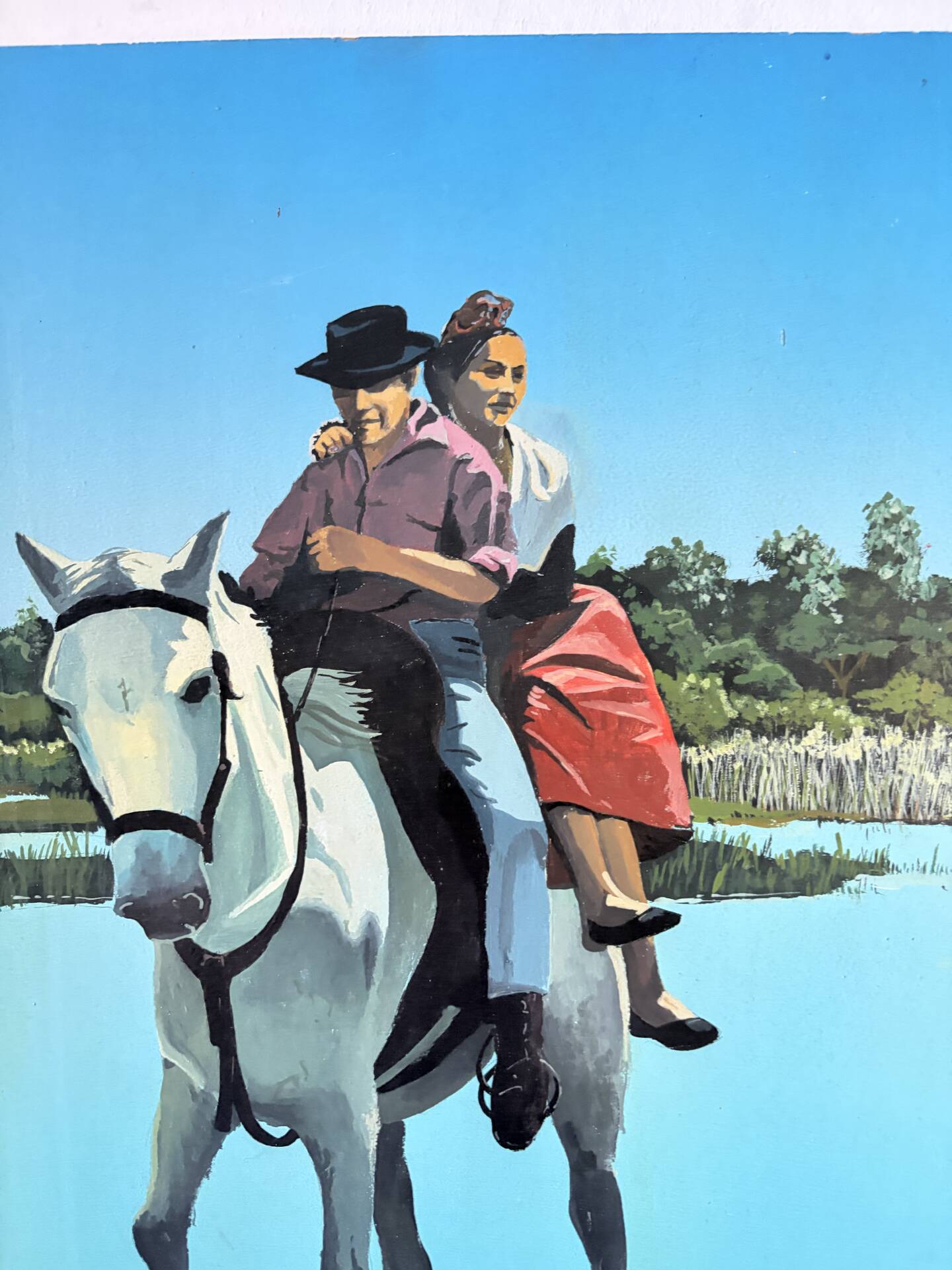 River crossing on horseback, on a sign by Campana.