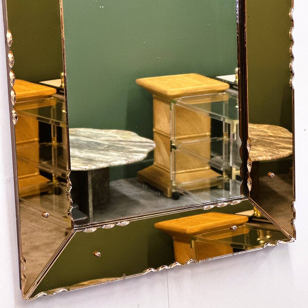 Striking French amber-coloured mirror with sculpted edge details, 1940s