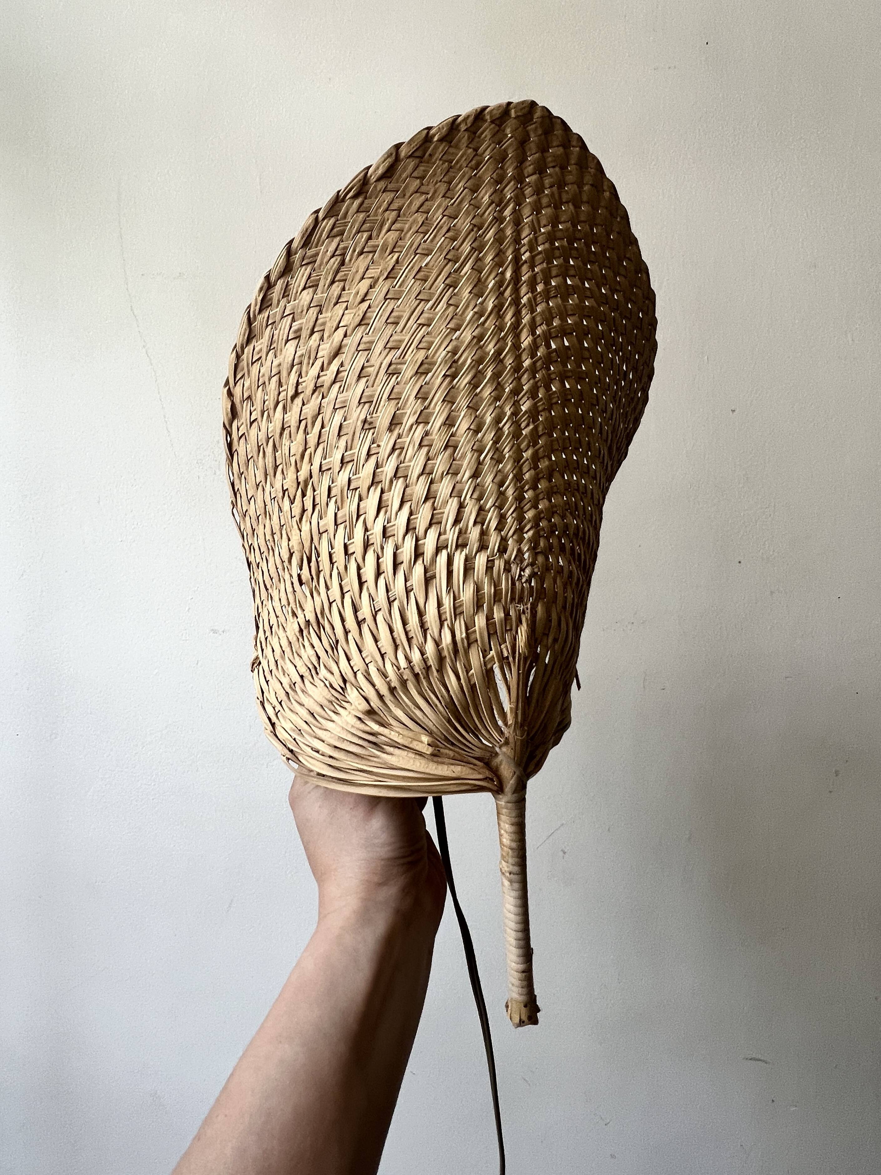 Woven rattan wall light in the style of Igno Maurer, design from the 1970s.