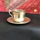 Silver metal cup and saucer