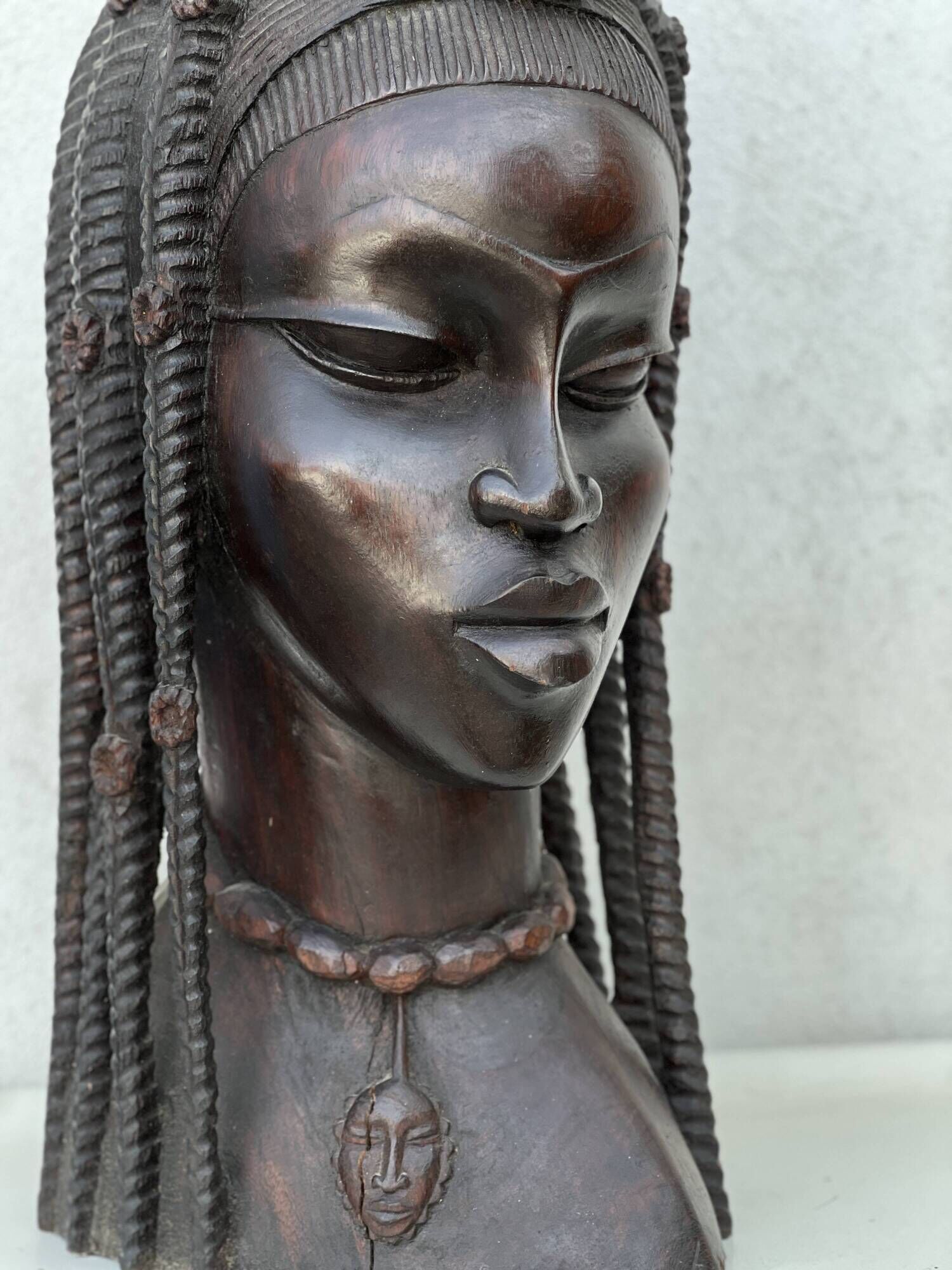 Large wooden bust of an African woman.