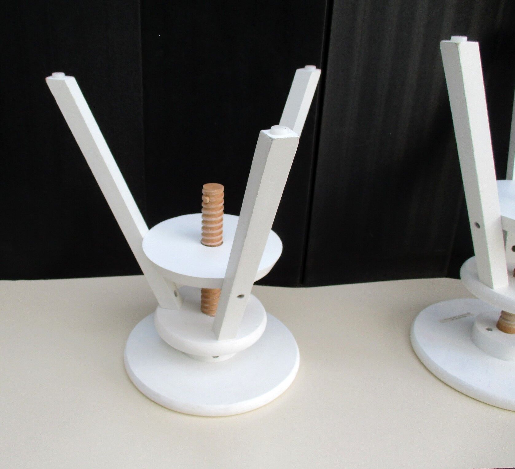 Two wooden screw stools for children