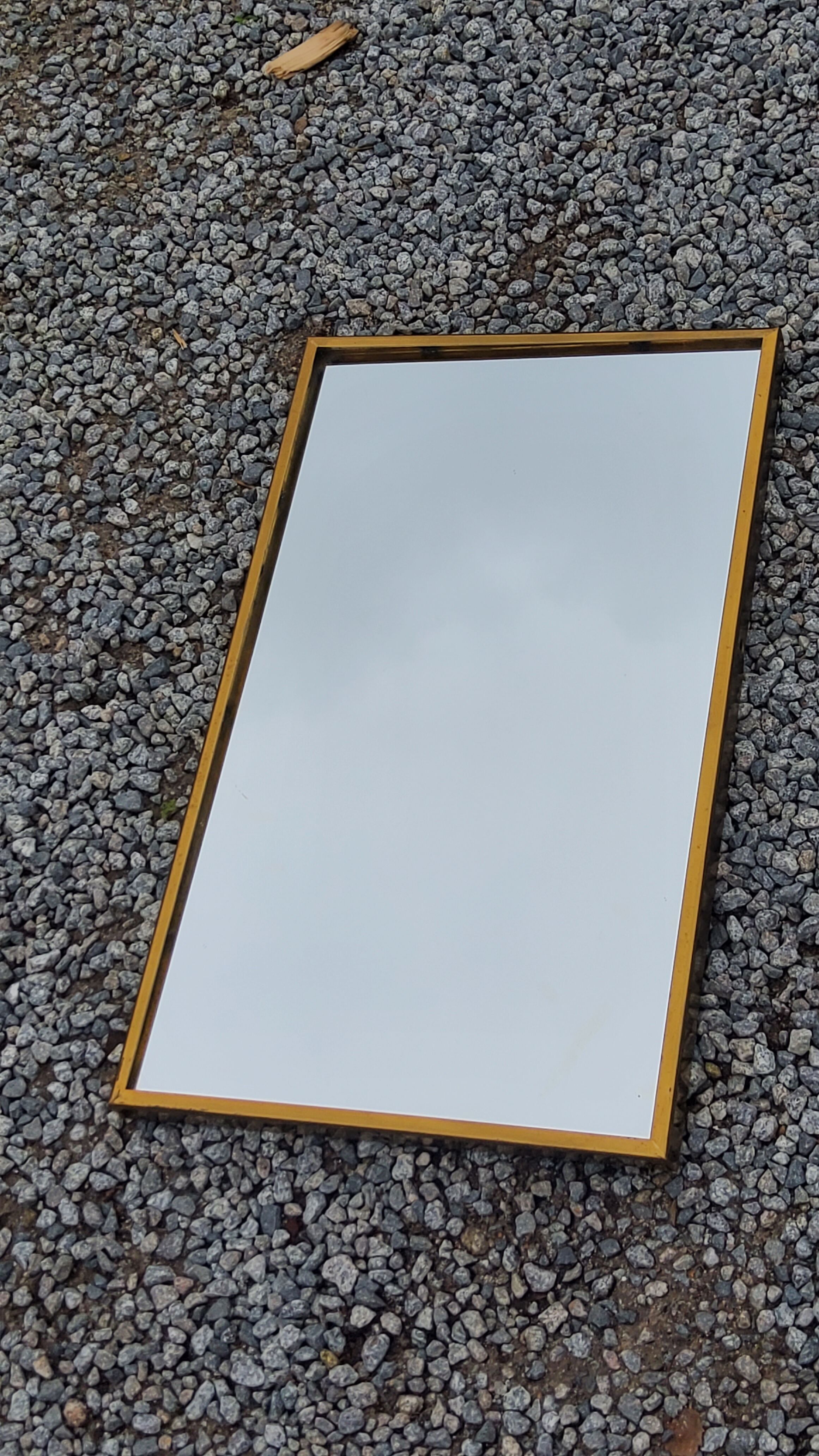 Mirror of the 70s in gilded metal, 60x35 cm