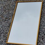 Mirror of the 70s in gilded metal, 60x35 cm