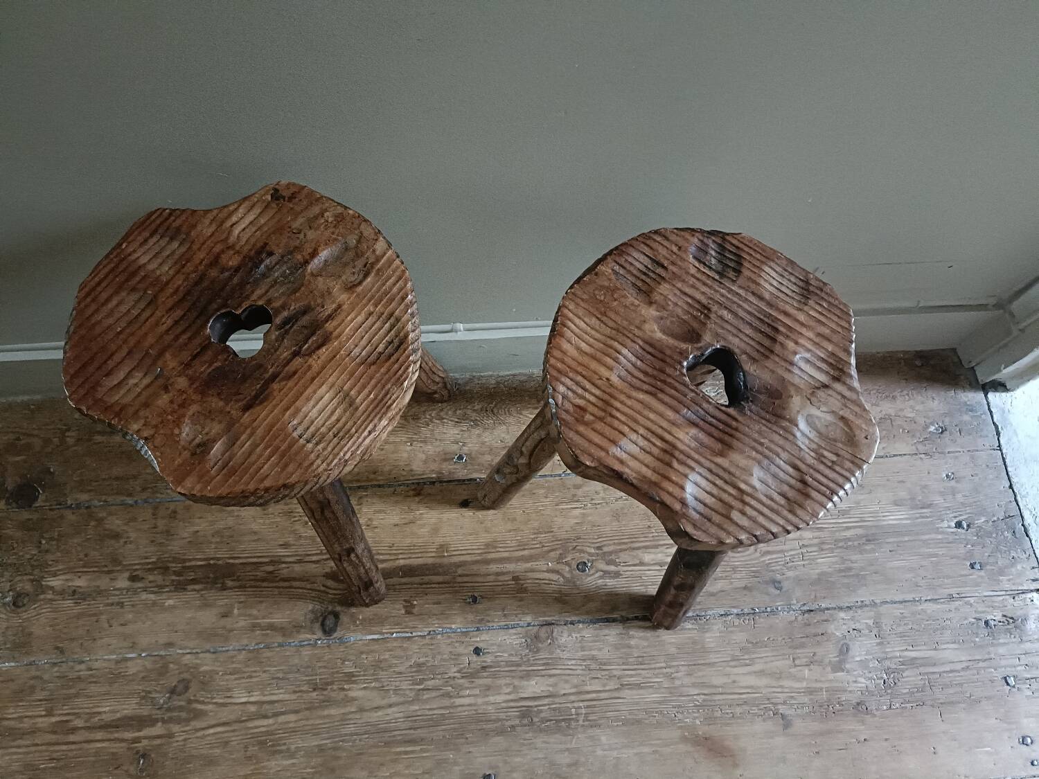 A pair of tripod stools