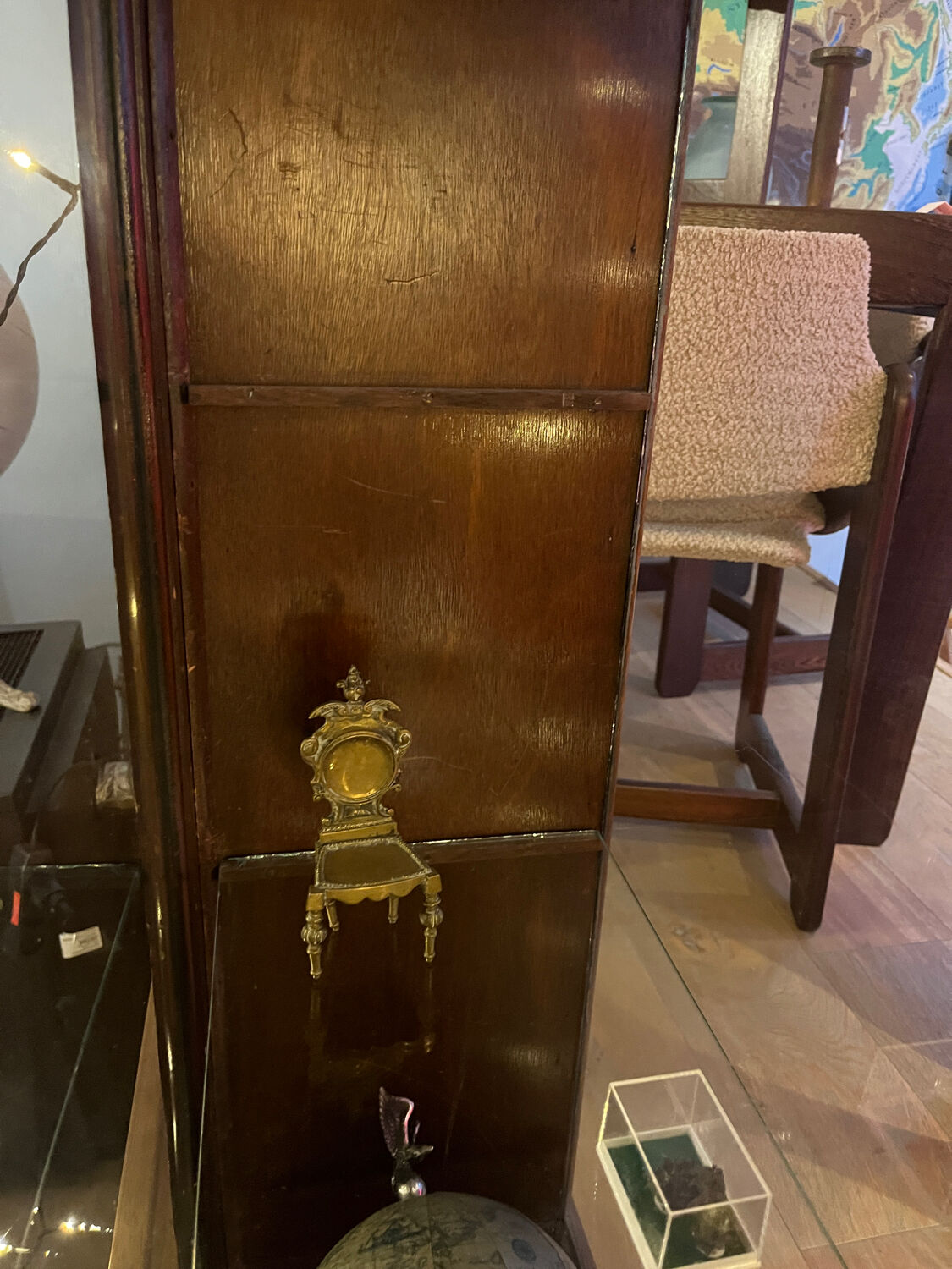 Dark-stained wood and glass vintage display cabinet — early 20th-century wall-mounted showcase