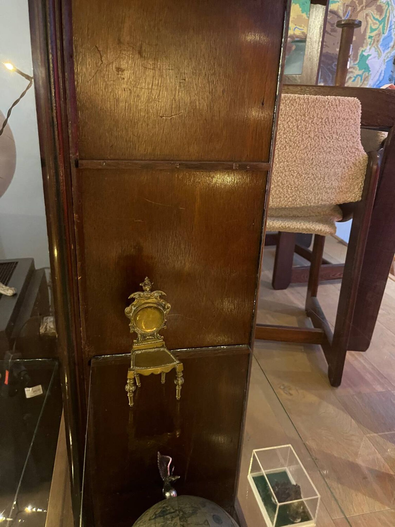 Dark-stained wood and glass vintage display cabinet — early 20th-century wall-mounted showcase