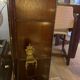 Dark-stained wood and glass vintage display cabinet — early 20th-century wall-mounted showcase