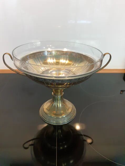 Art Deco brass cup and its engraved saucer.