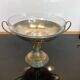 Art Deco brass cup and its engraved saucer.
