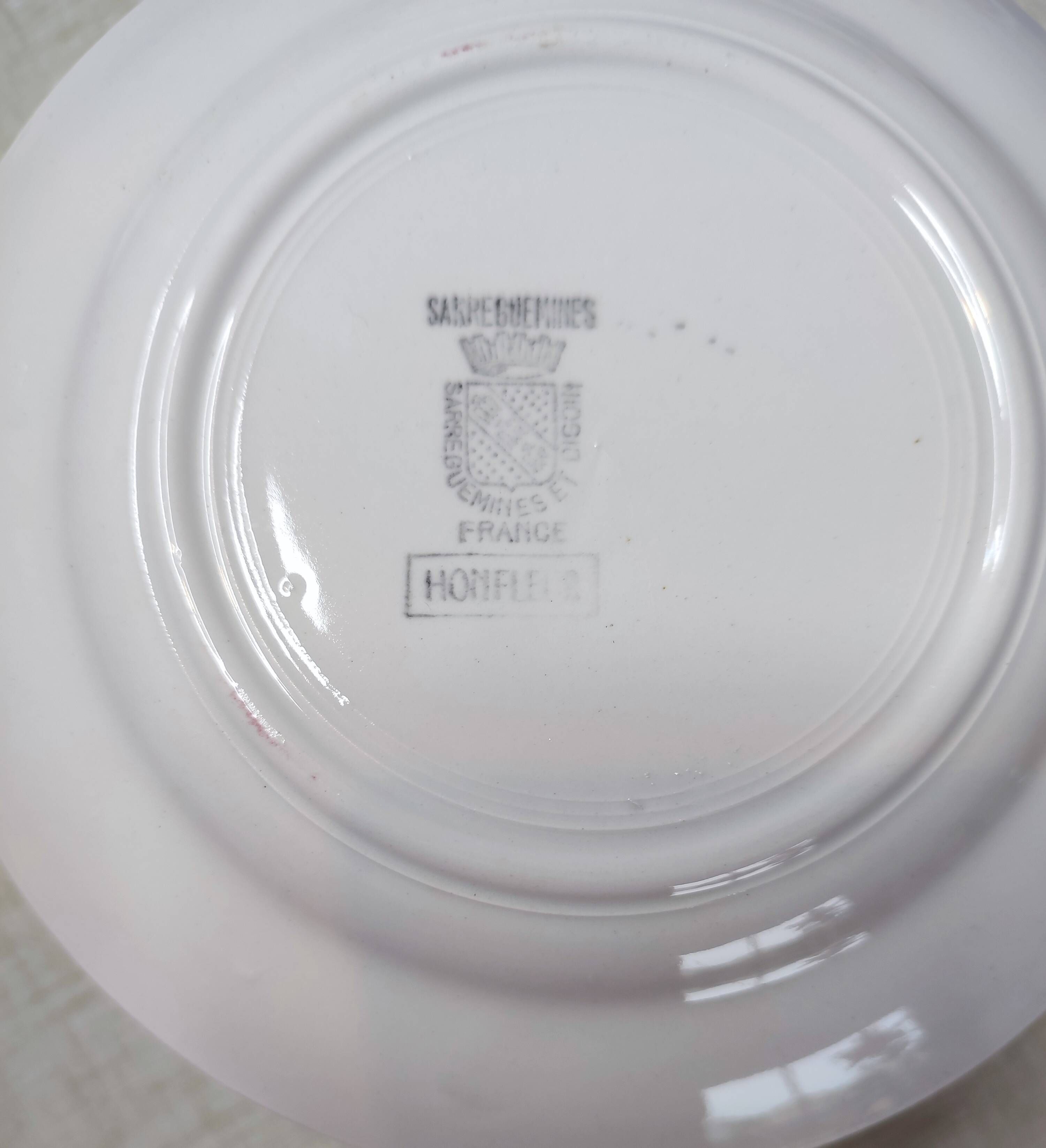 Lot of 17 vintage porcelain plates and a platter from the 1940s