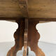 Round table in solid wood, thick top, vintage brutalist style from the 1960s.