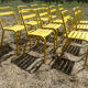 Lot of 11 yellow metallic bistro chairs from the 1950s