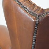 Very beautiful, stately, cowhide Chesterfield wing chair with elegant legs in a nice brown color