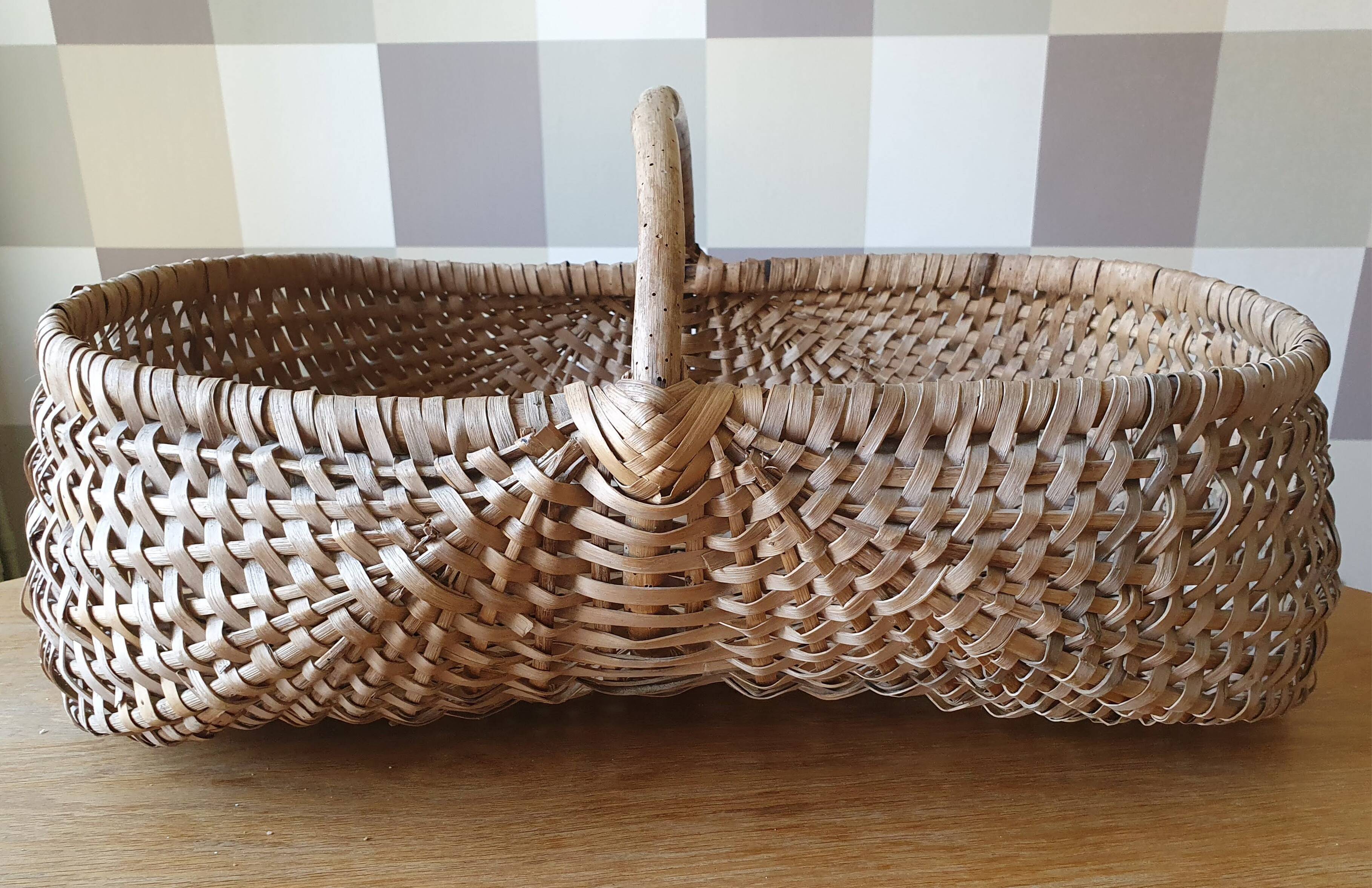 Burgundy basket in braided wicker